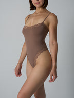 Corrigerende bodysuit met kanten afwerking